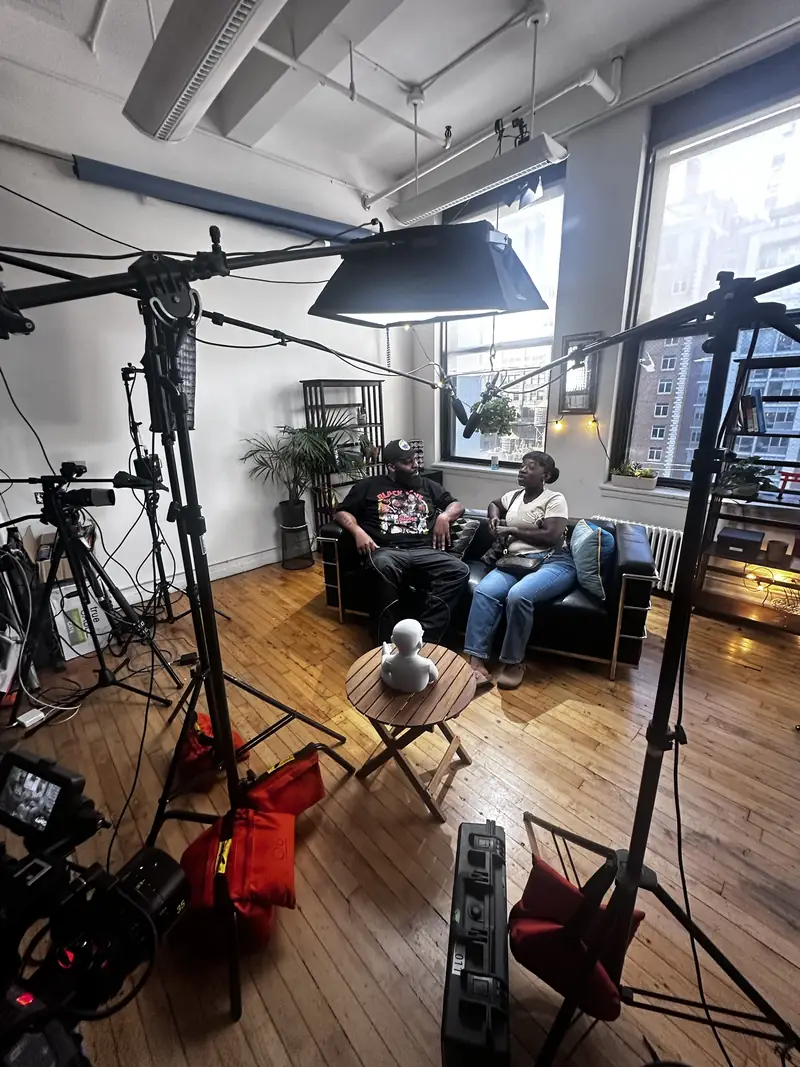 A couple in conversation on the AL the Show set
