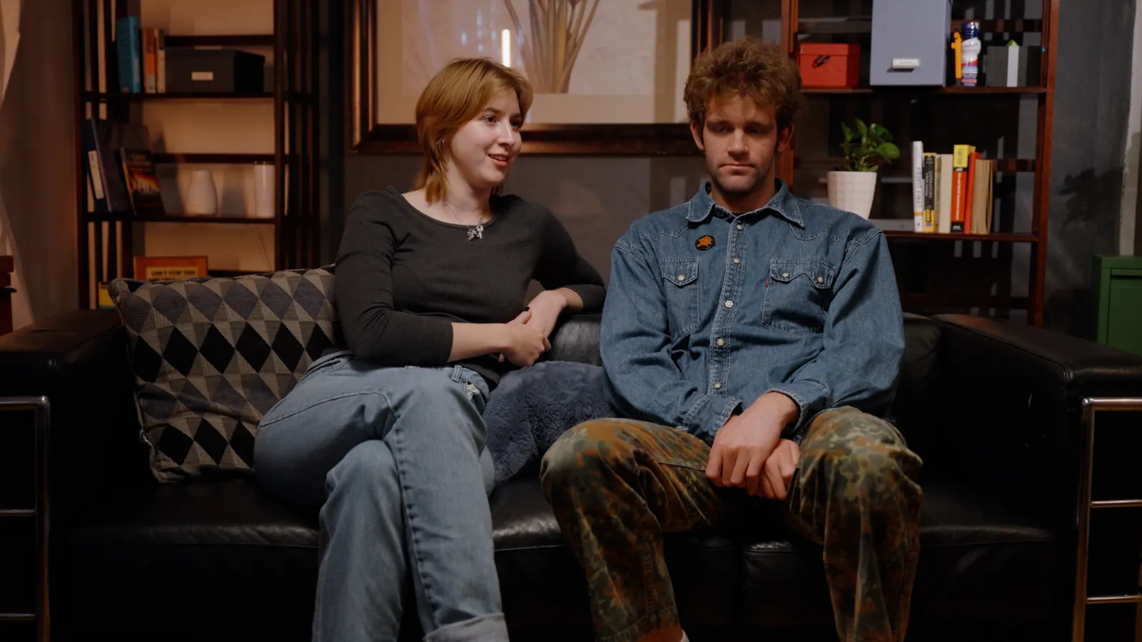 A young couple side by side on the AL: The Show couch