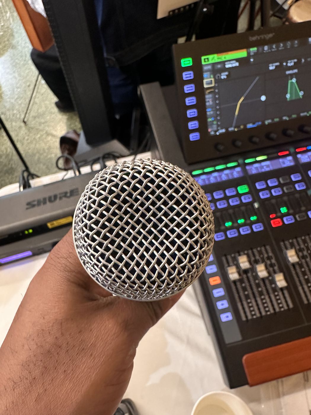 Wireless microphone and mixing console at an NYC event
