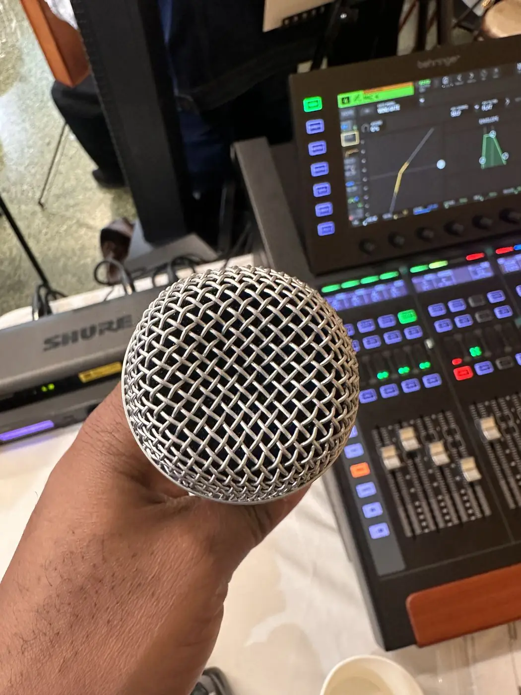 Wireless microphone and mixing console at an NYC event