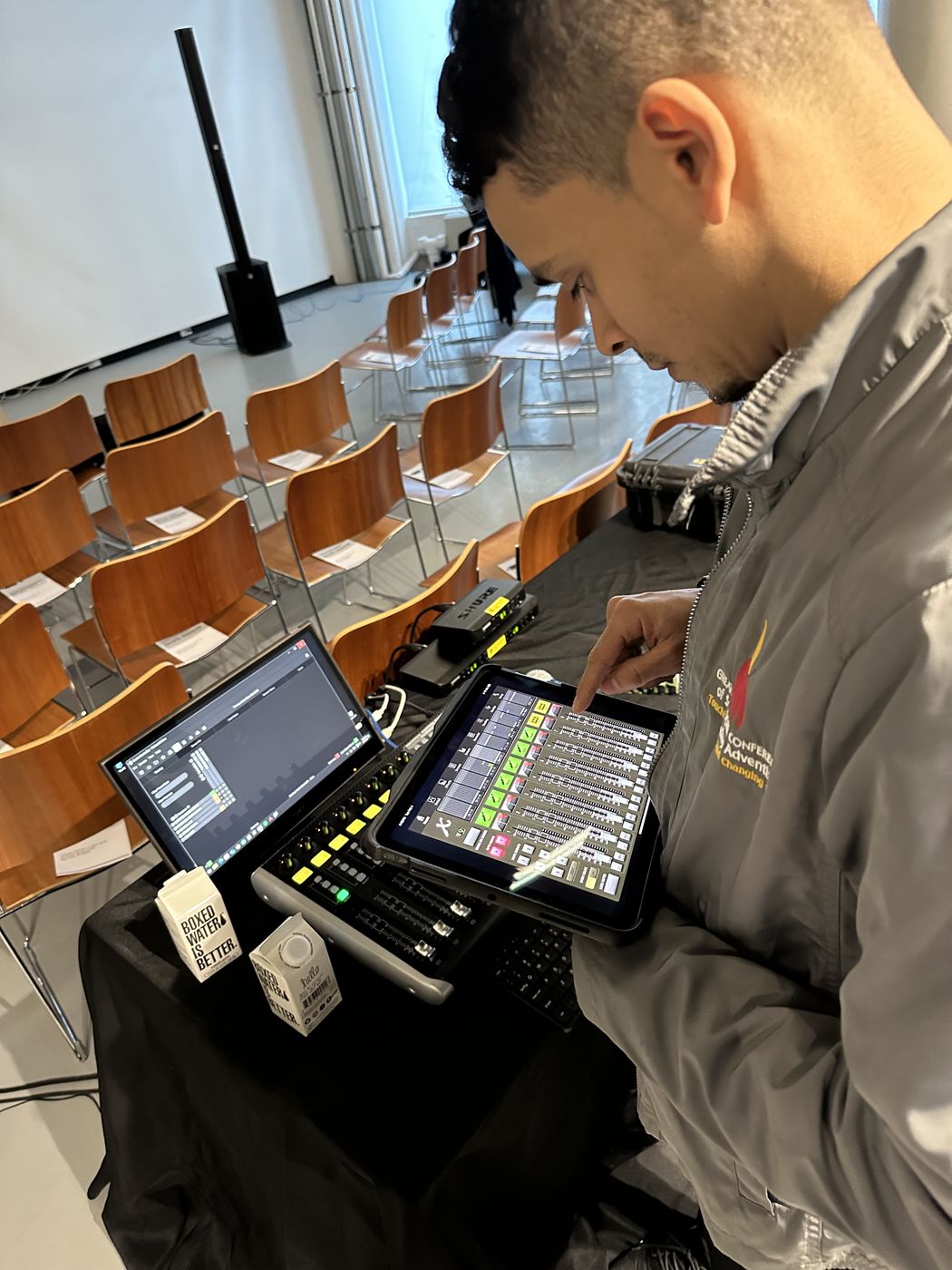 Audio engineer coordinating wireless systems on site at a New York event