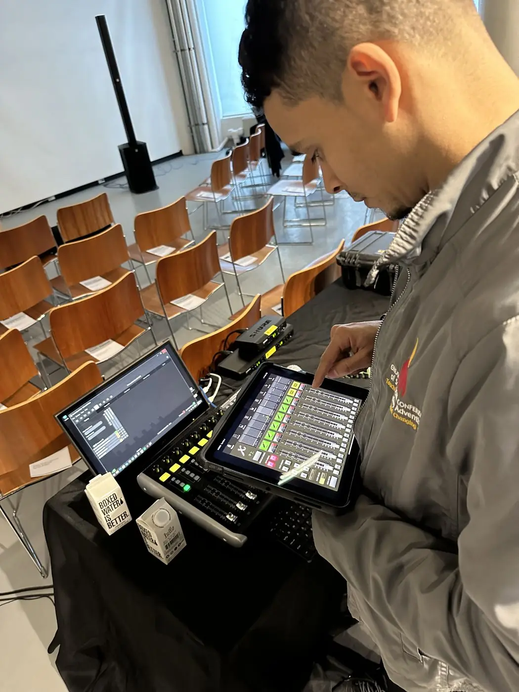 Audio engineer coordinating wireless systems on site at a New York event