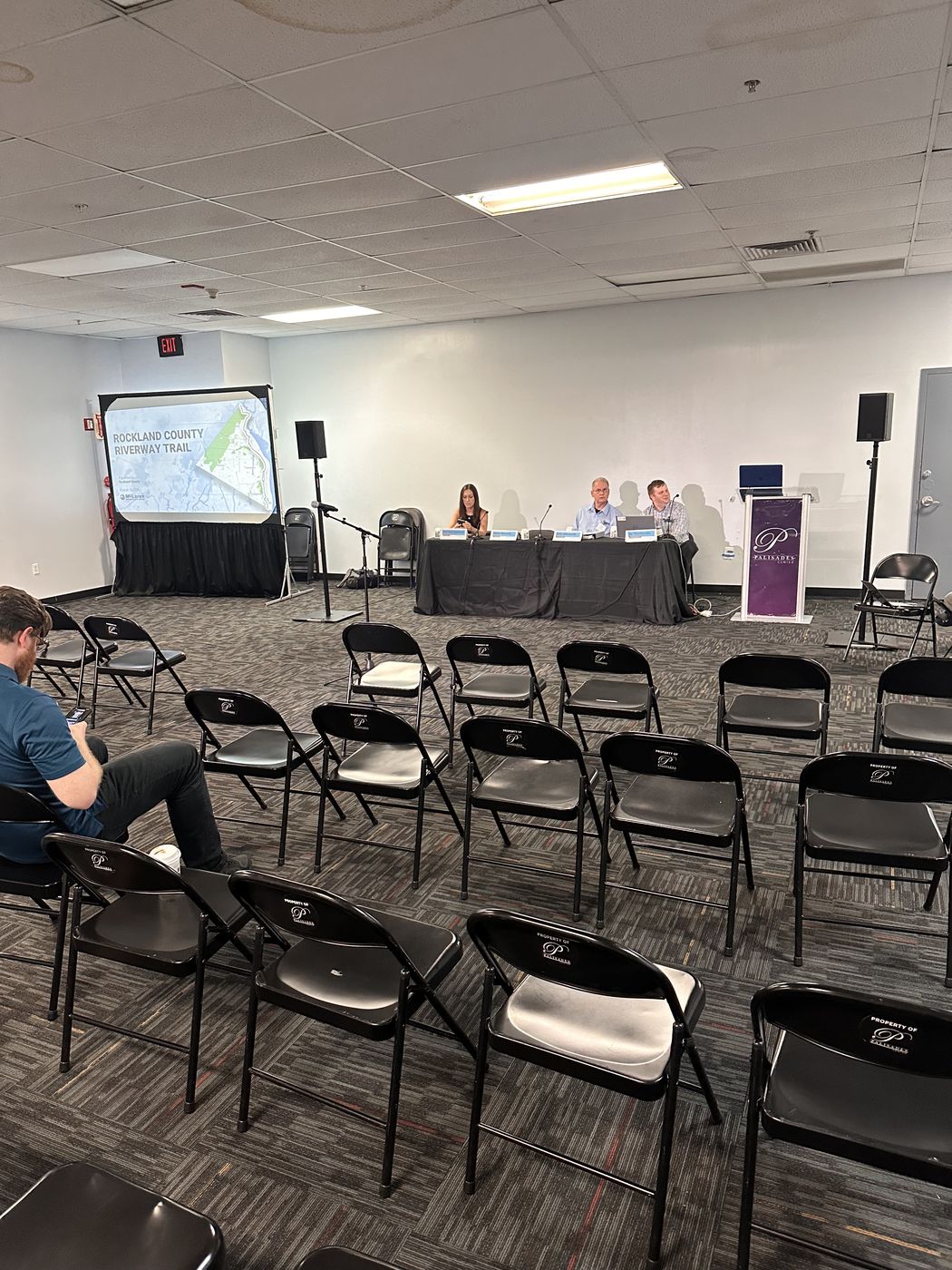 Conference room transformed with stage lighting, projection, and panel setup by Transcendent Enterprise