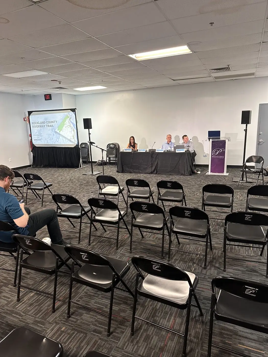Conference room transformed with stage lighting, projection, and panel setup by Transcendent Enterprise