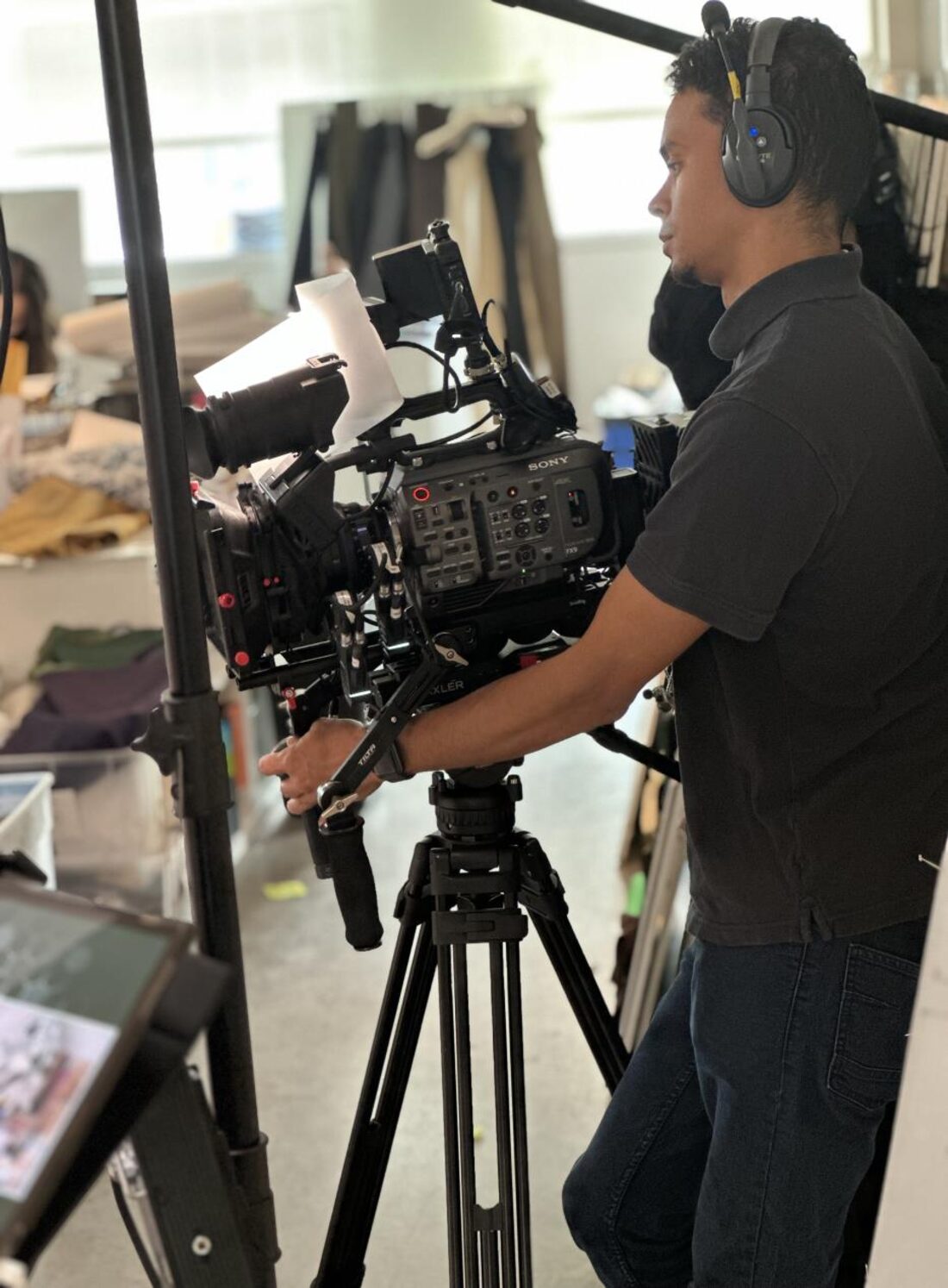 Camera operator filming on location