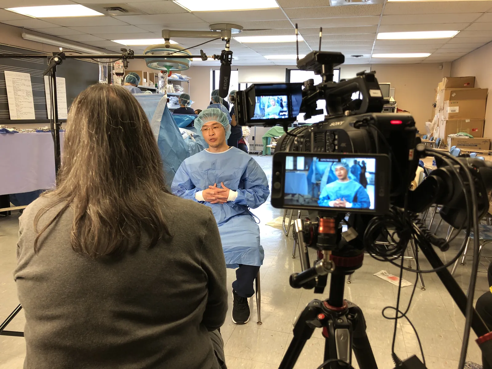The Transcendent crew filming a clinician in scrubs for a healthcare interview