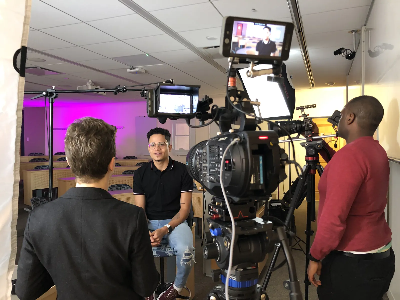 Two Transcendent operators on two cameras covering a seated interview