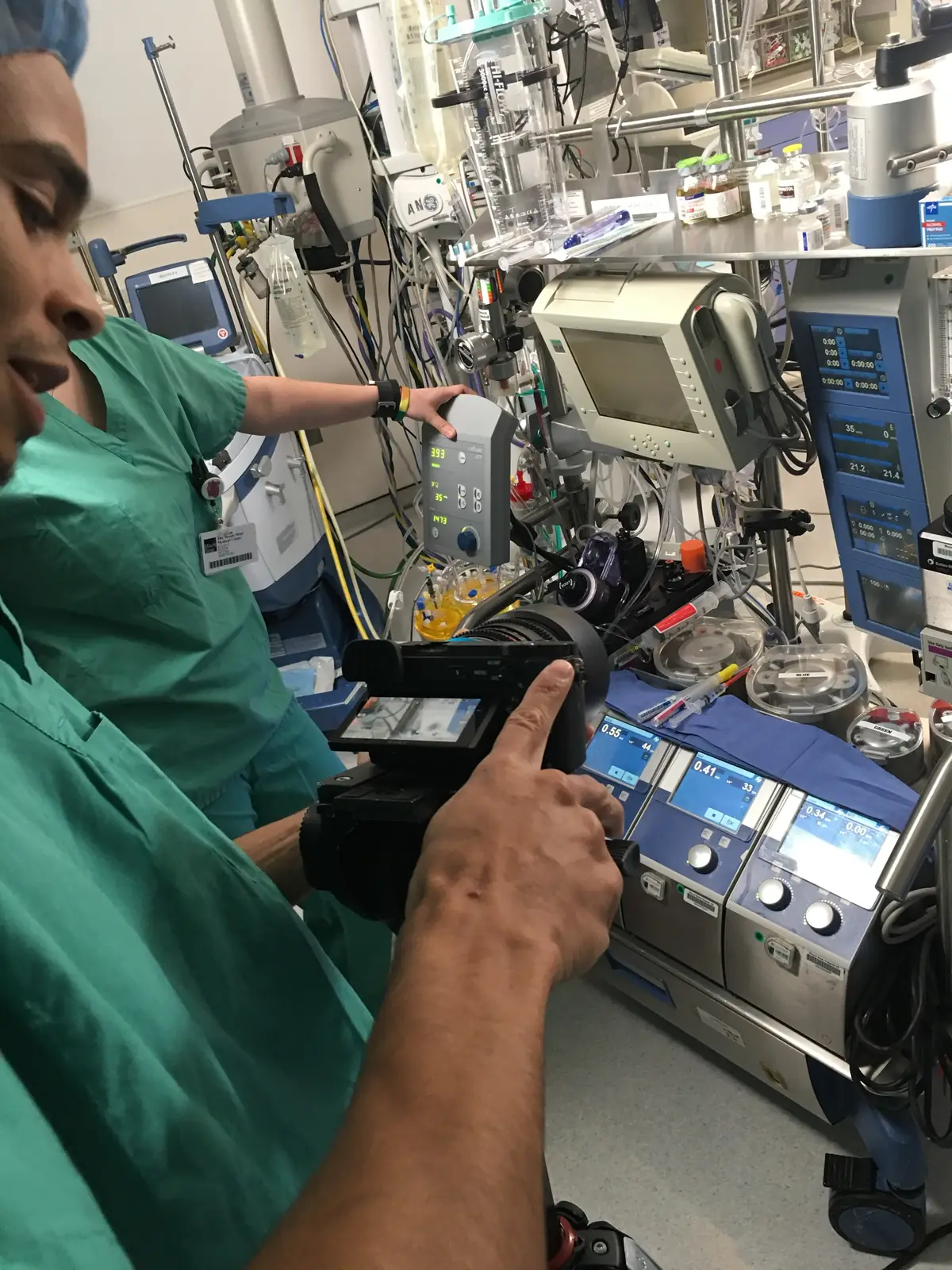 Transcendent Enterprise camera operator in scrubs filming a perfusion station during a Mount Sinai cardiac surgery production