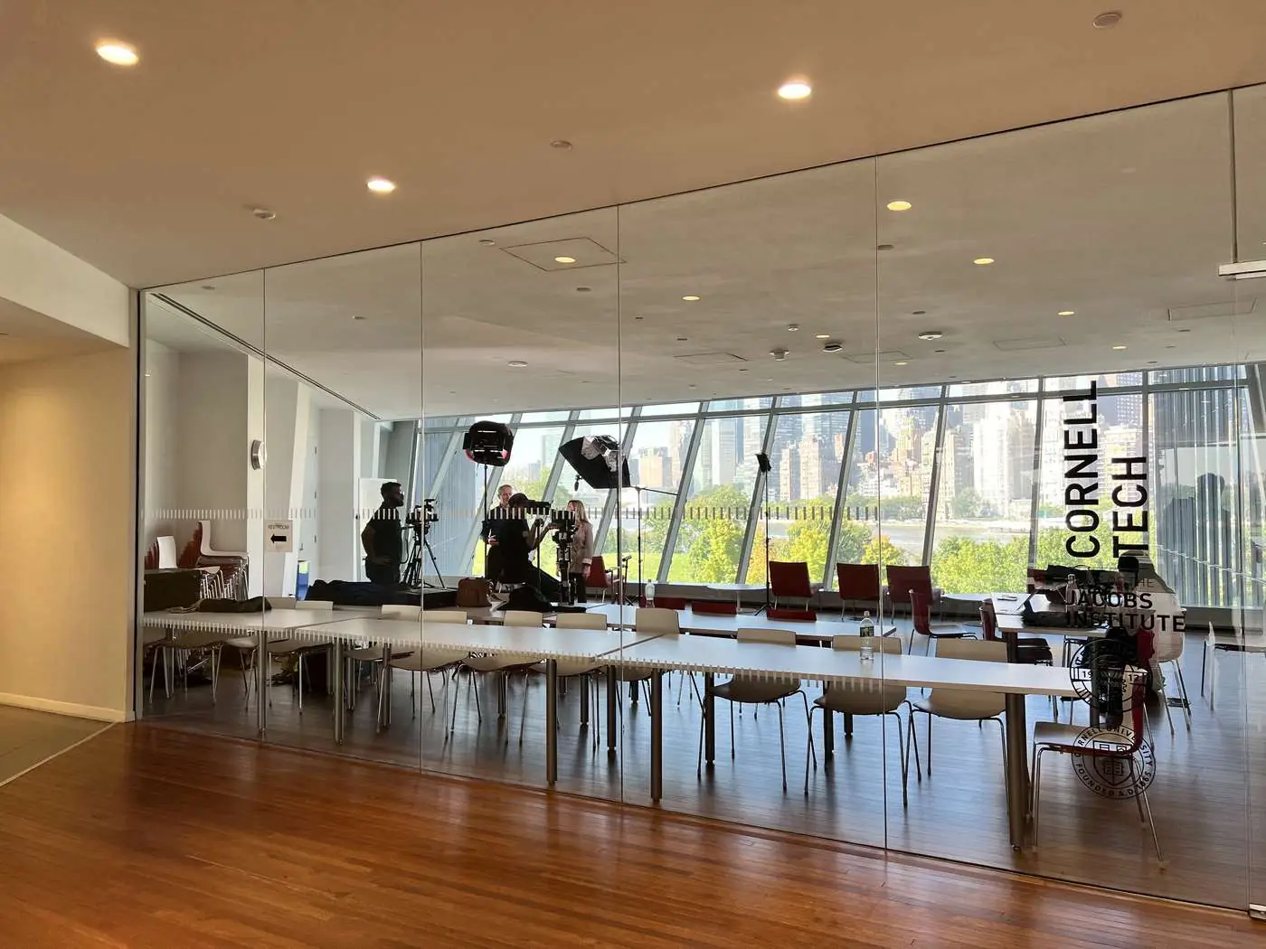 Transcendent Enterprise crew setting up an interview at Cornell Tech's Jacobs Institute with the Manhattan skyline behind