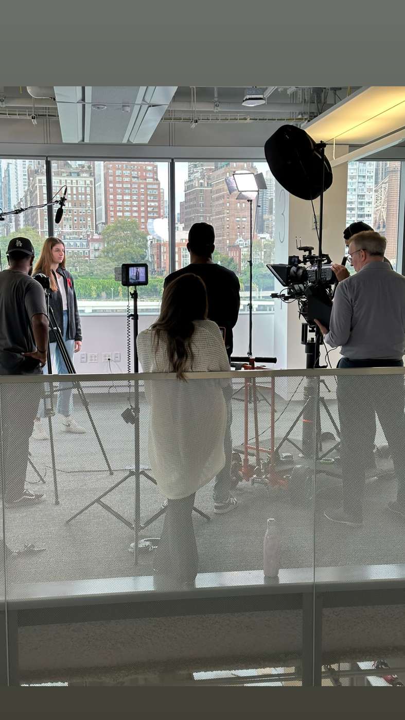 Student on camera during a university shoot with teleprompter support in New York City