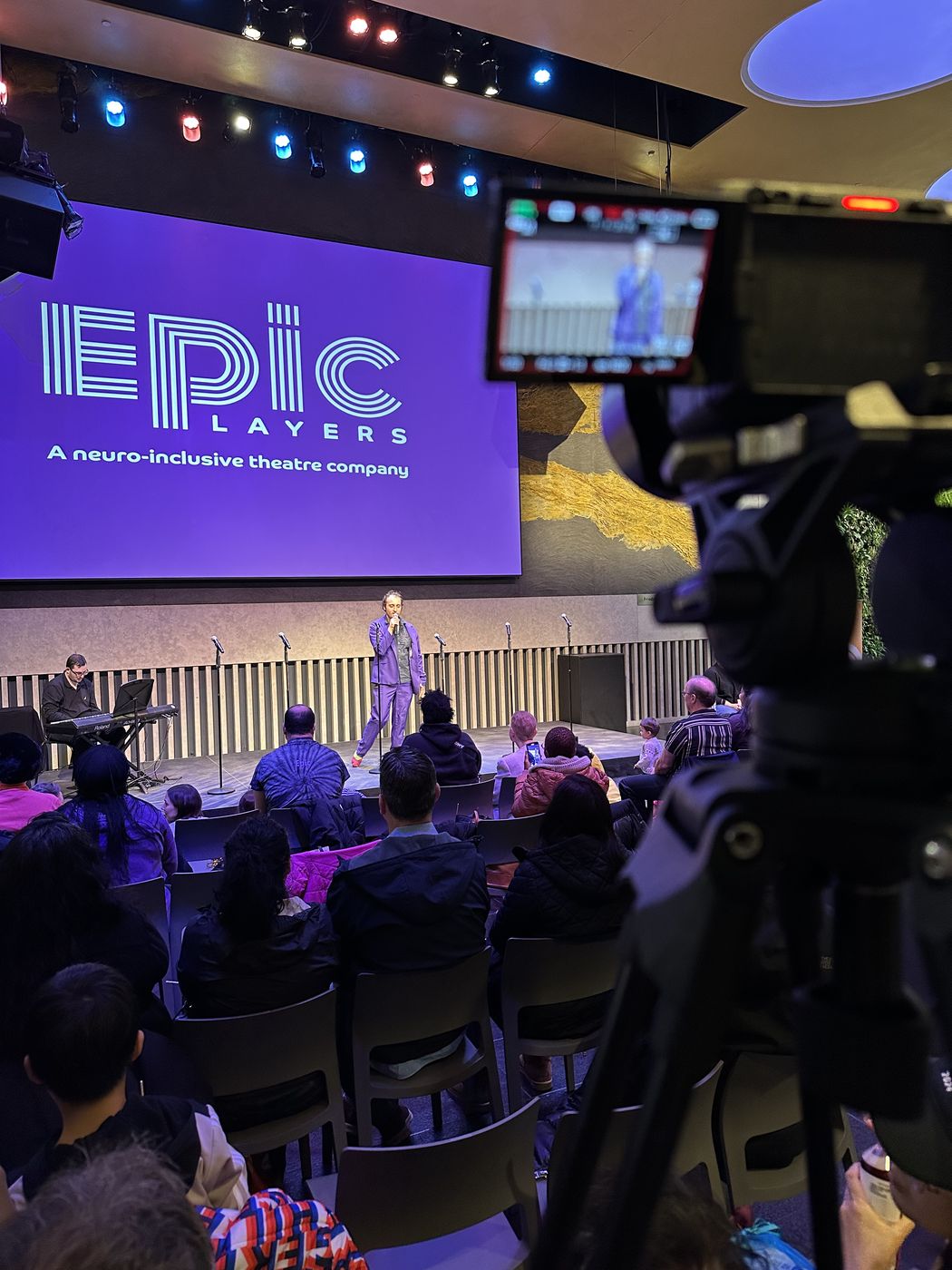 Camera and screen at a live streamed community event