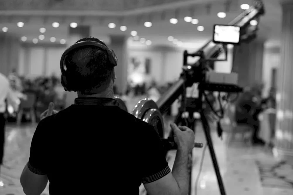 A camera operator captures footage for a video production at a client’s live event